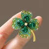 Wholesale of crystal four-leaf clover brooches, New Year's simple and versatile brooches for women, elegant corsages, and clothing accessories