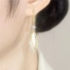 The new high-end golden dreamcatcher net earrings are fashionable, versatile and elegant for female Internet celebrities. Three lives and three worlds ear rings The new high-end golden dreamcatcher net earrings are fashionable, versatile and elegant for female Internet celebrities. Three lives and three worlds ear rings