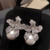 Niche and fashionable new light luxury style earrings with diamonds, women's high-end touch, lily flower, pearl flower and elegant ear accessories Niche and fashionable new light luxury style earrings with diamonds, women's high-end touch, lily flower, pearl flower and elegant ear accessories