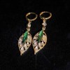 Sparkling zircon green leaf versatile ear clings, golden branch and jade leaf earrings, new trendy ear accessories Sparkling zircon green leaf versatile ear clings, golden branch and jade leaf earrings, new trendy ear accessories