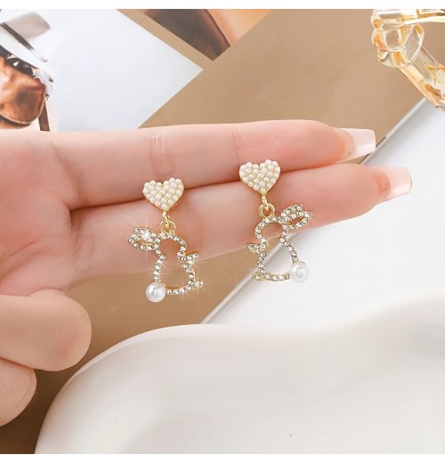 Easter asymmetrical stud earrings, a popular online celebrity, are exquisite and versatile earrings with a niche design. They are cross-border diamond-encrusted and pearles-encrusted