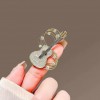 Design sense, individuality, niche musical note guitar brooch, high-end and elegant clothing pin,  new suit accessory