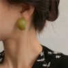 A girl with summer silver needle earrings made of colored acrylic, featuring a niche design, a fashionable and retro style, and a cold Korean style A girl with summer silver needle earrings made of colored acrylic, featuring a niche design, a fashionable and retro style, and a cold Korean style
