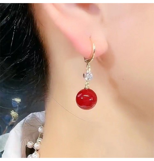 New trendy and retro red pearl earring style best-selling high-end and elegant niche earrings, round face slimming earrings for women