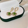 Cat's eye stone ginkgo leaf earrings, with a niche design sense, high-end cold style, and silver ear studs, a new luxury item for women in Cat's eye stone ginkgo leaf earrings, with a niche design sense, high-end cold style, and silver ear studs, a new luxury item for women in
