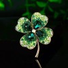 Wholesale of crystal four-leaf clover brooches, New Year's simple and versatile brooches for women, elegant corsages, and clothing accessories