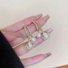 Ginkgo leaf pearl earrings, a light luxury and high-end style for women, French ear buckles, unique and niche earrings, and elegant ear studs and earrings