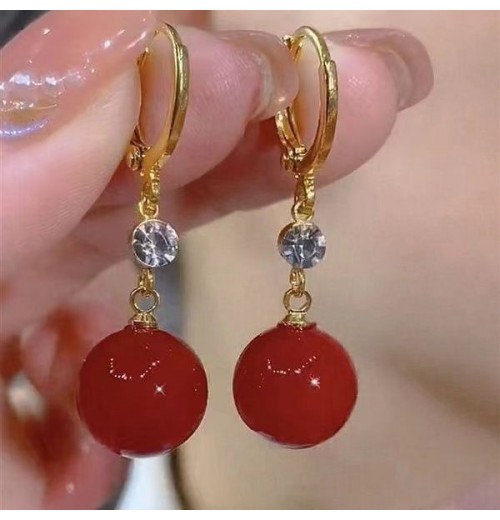 New trendy and retro red pearl earring style best-selling high-end and elegant niche earrings, round face slimming earrings for women