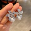Niche and fashionable new light luxury style earrings with diamonds, women's high-end touch, lily flower, pearl flower and elegant ear accessories Niche and fashionable new light luxury style earrings with diamonds, women's high-end touch, lily flower, pearl flower and elegant ear accessories